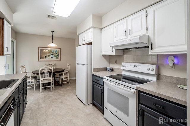 kitchen with white cabinetry, white appliances, tasteful backsplash, and hanging light fixtures