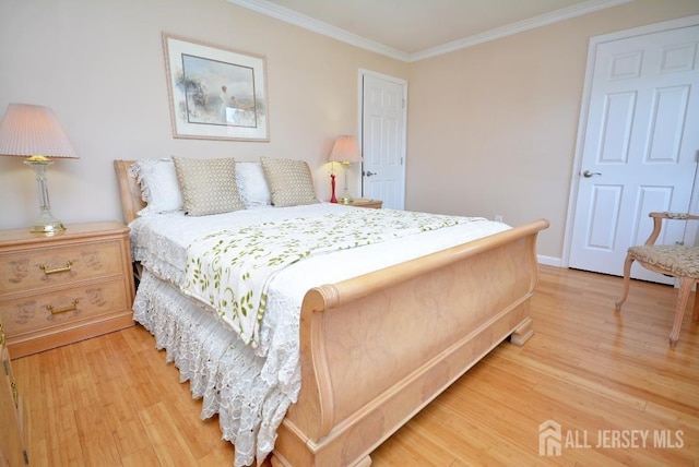 107 N Edward St, Sayreville, NJ 08872 - bedroom featuring ornamental molding and light wood finished floors