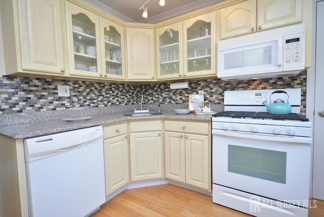107 N Edward St, Sayreville, NJ 08872 - kitchen with white appliances, cream cabinetry, and glass insert cabinets