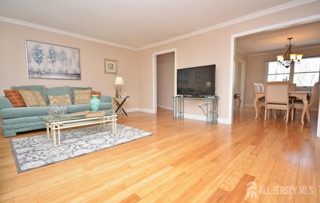 107 N Edward St, Sayreville, NJ 08872 - living room featuring wood finished floors, a chandelier, and crown molding