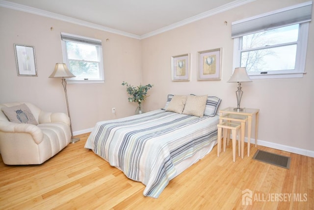 107 N Edward St, Sayreville, NJ 08872 - bedroom with wood finished floors and crown molding