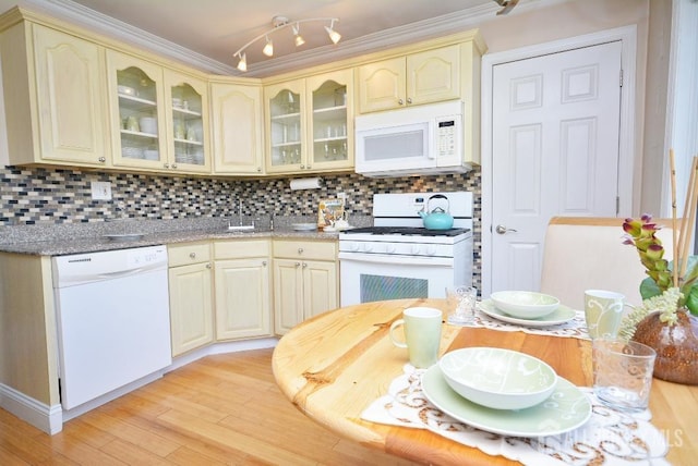 107 N Edward St, Sayreville, NJ 08872 - kitchen with white appliances, cream cabinetry, light wood-type flooring, decorative backsplash, and ornamental molding