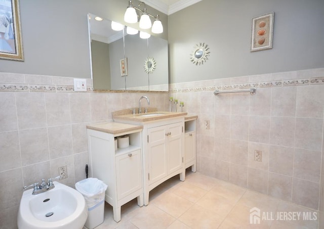107 N Edward St, Sayreville, NJ 08872 - bathroom with tile walls, crown molding, a bidet, vanity, and a wainscoted wall