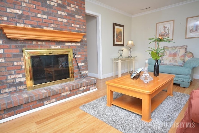 107 N Edward St, Sayreville, NJ 08872 - living room with wood finished floors, a fireplace, and ornamental molding
