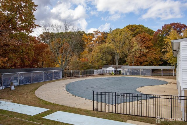 view of swimming pool with a patio