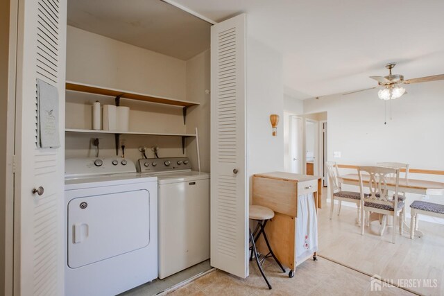 laundry room featuring washer and dryer and ceiling fan