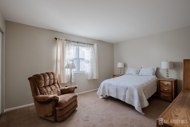 carpeted bedroom with baseboards