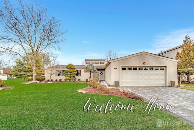 view of front of house with a garage and a front yard