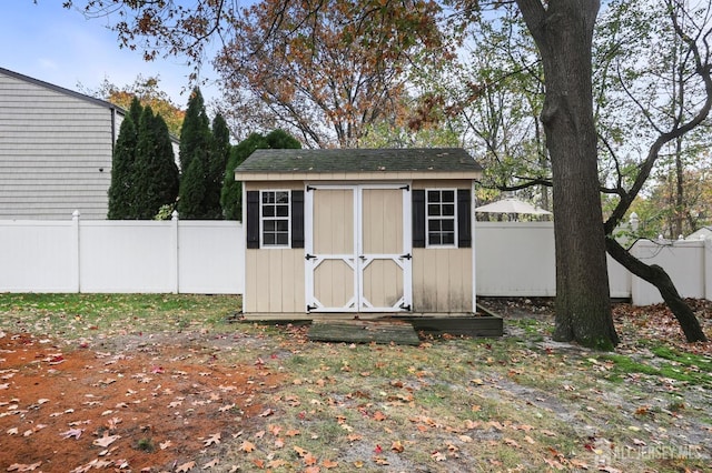 view of shed with a fenced backyard