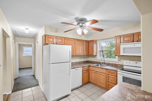 kitchen featuring sink, white appliances, light tile patterned floors, and ceiling fan