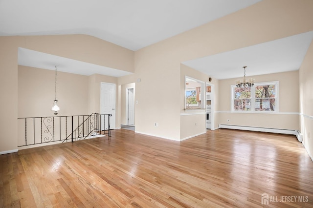 unfurnished room featuring vaulted ceiling, light wood-type flooring, a baseboard radiator, and an inviting chandelier