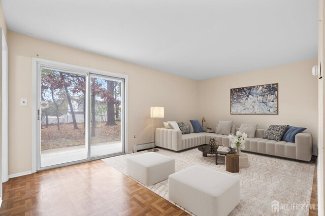 living room featuring parquet floors and a baseboard radiator