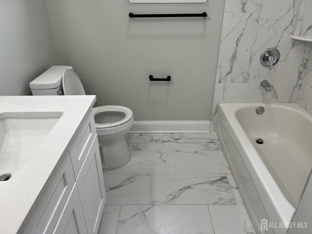 21 Catherine St, Carteret, NJ 07008 - bathroom with baseboards, toilet, vanity,  shower combination, and marble finish floor