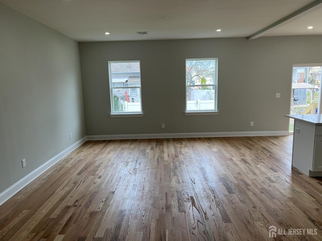 21 Catherine St, Carteret, NJ 07008 - empty room with recessed lighting, visible vents, wood finished floors, and baseboards