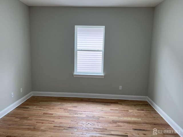 21 Catherine St, Carteret, NJ 07008 - unfurnished room featuring wood finished floors and baseboards