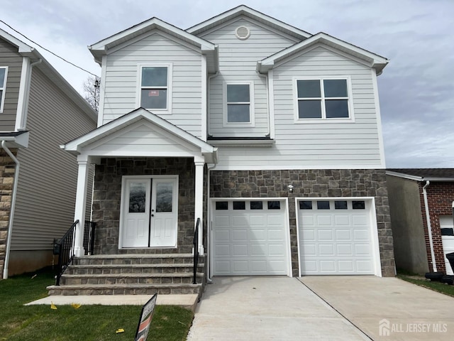 21 Catherine St, Carteret, NJ 07008 - traditional-style house with driveway, stone siding, and an attached garage