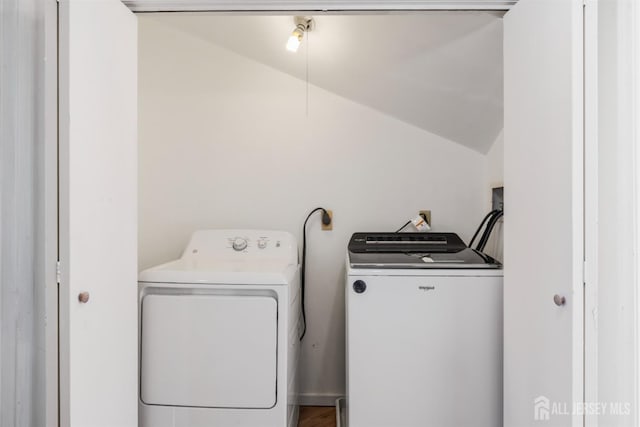 laundry area featuring washing machine and clothes dryer