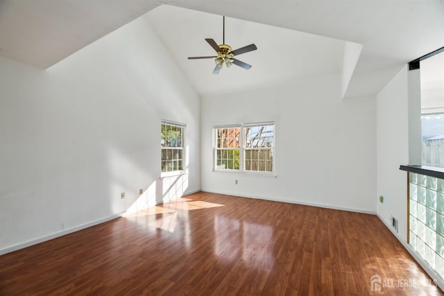 spare room with ceiling fan, high vaulted ceiling, and hardwood / wood-style floors