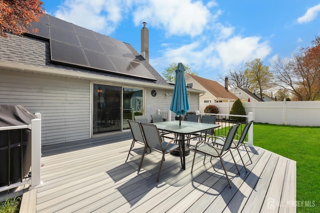 wooden terrace with outdoor dining space