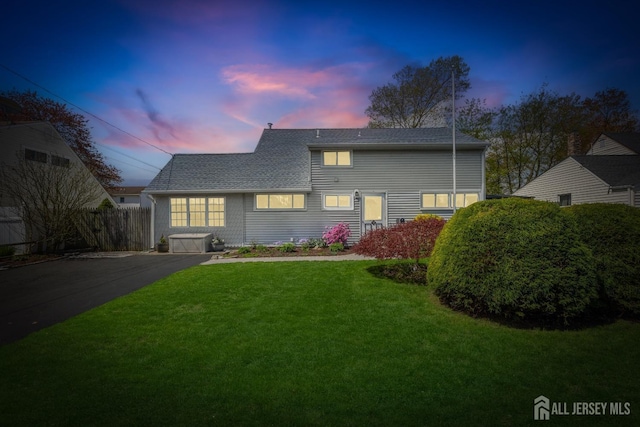 view of front of house with a shingled roof