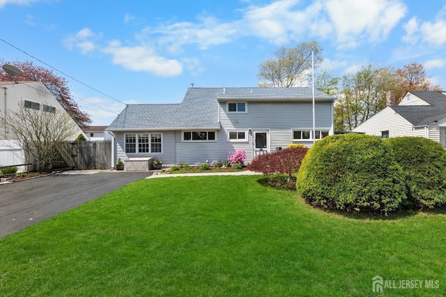 view of front of home with roof with shingles