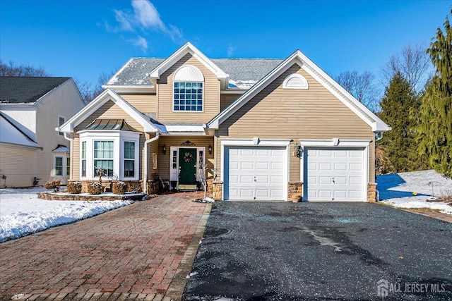 view of front of property with a garage