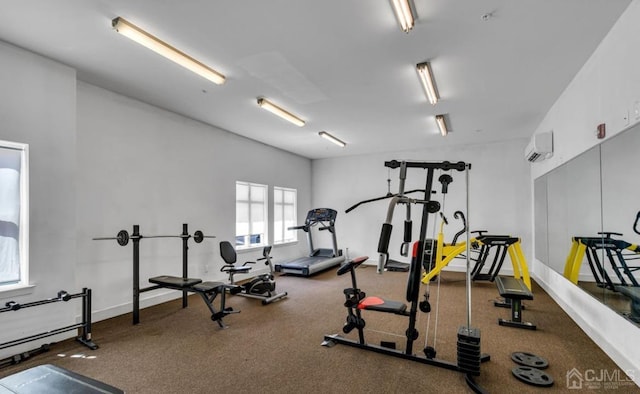 gym featuring an AC wall unit