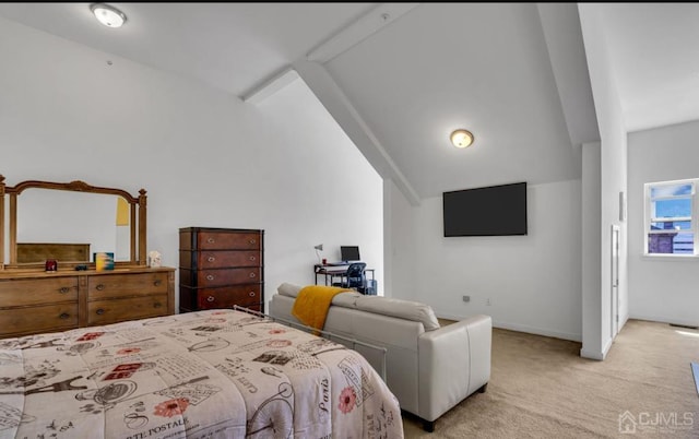 bedroom with light colored carpet and vaulted ceiling