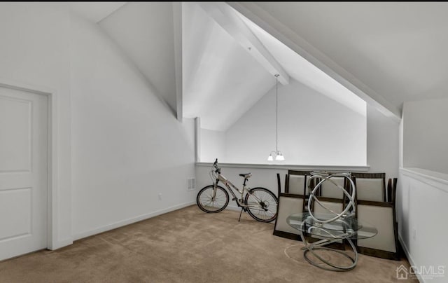 miscellaneous room with light colored carpet, lofted ceiling with beams, and a notable chandelier