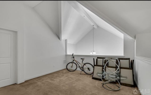 additional living space with lofted ceiling with beams, baseboards, and carpet floors