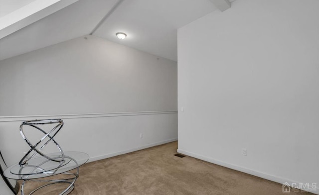 bonus room featuring lofted ceiling and light carpet