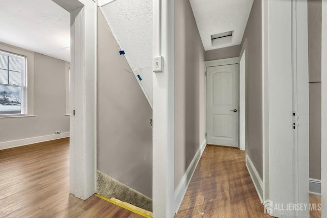 hallway featuring hardwood / wood-style floors