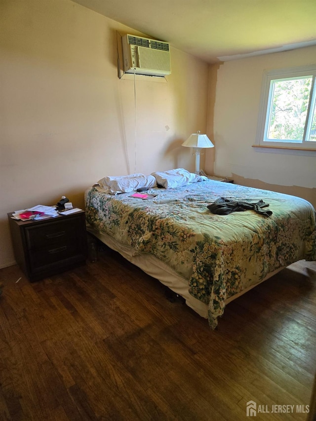 42 Hyde Ave, Iselin, NJ 08830 - bedroom featuring a wall mounted air conditioner and wood finished floors