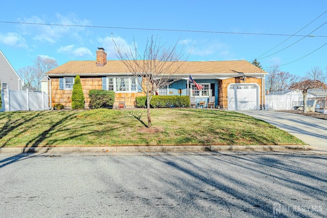 single story home with a garage and a front lawn