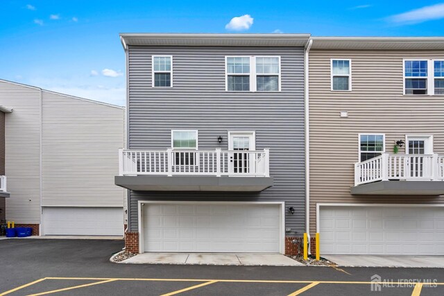 1915 Switzer Ave, Parlin, NJ 08859 - back of house with brick siding and a garage