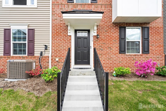 1915 Switzer Ave, Parlin, NJ 08859 - view of exterior entry with central air condition unit and brick siding