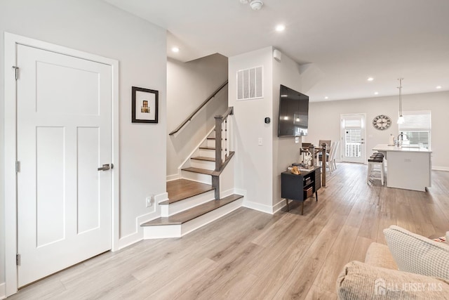 1915 Switzer Ave, Parlin, NJ 08859 - stairway featuring wood finished floors, recessed lighting, and baseboards