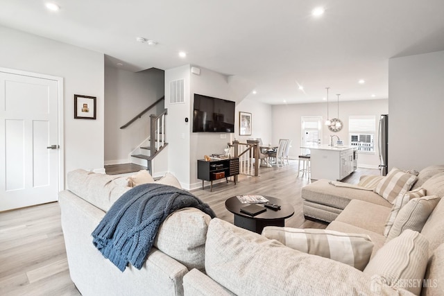1915 Switzer Ave, Parlin, NJ 08859 - living room with light wood-style floors, stairway, recessed lighting, and baseboards