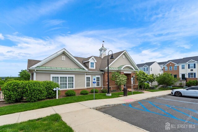 1915 Switzer Ave, Parlin, NJ 08859 - view of building exterior with uncovered parking and a residential view