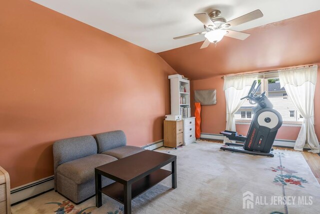 124 6th Ave, Middlesex, NJ 08846 - living area featuring a baseboard heating unit, vaulted ceiling, baseboard heating, ceiling fan, and baseboards