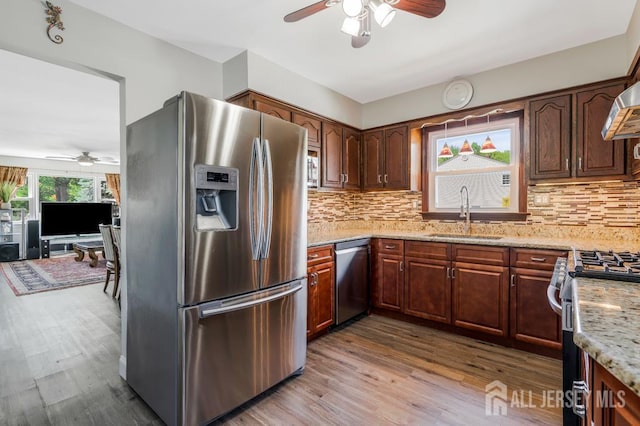 124 6th Ave, Middlesex, NJ 08846 - kitchen with stainless steel appliances, a ceiling fan, a sink, and wood finished floors