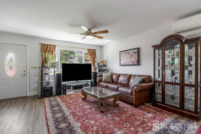 124 6th Ave, Middlesex, NJ 08846 - living room with a wall mounted AC, wood finished floors, ceiling fan, and baseboards