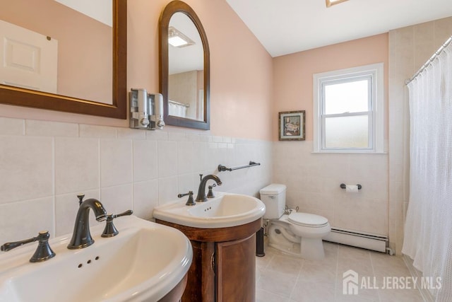 124 6th Ave, Middlesex, NJ 08846 - full bathroom featuring a baseboard heating unit, a sink, tile walls, toilet, and tile patterned floors