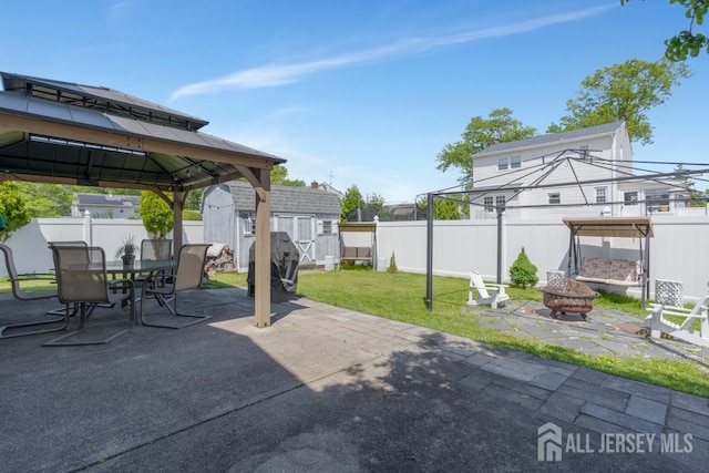 124 6th Ave, Middlesex, NJ 08846 - view of patio / terrace featuring a fire pit, a gazebo, a shed, an outbuilding, and outdoor dining space