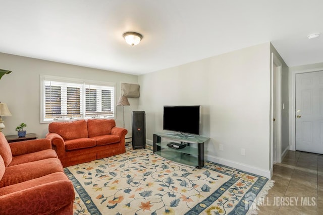 124 6th Ave, Middlesex, NJ 08846 - living area with baseboards and a baseboard heating unit