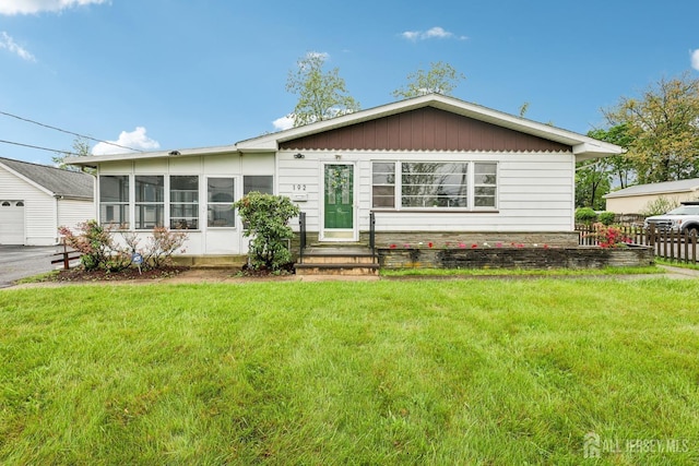 192 Lakeview Ave, Piscataway, NJ 08854 - view of front of property with a front lawn, entry steps, and a garage