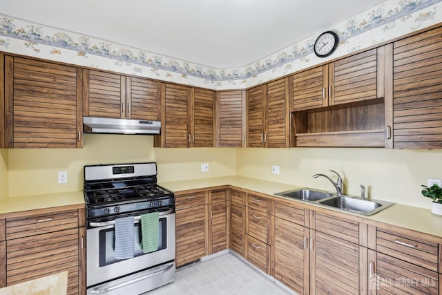 192 Lakeview Ave, Piscataway, NJ 08854 - kitchen featuring stainless steel gas range oven, under cabinet range hood, open shelves, light countertops, and wallpapered walls