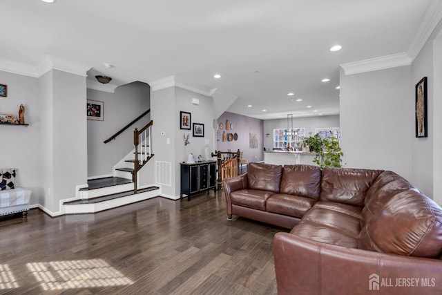 living area with recessed lighting, crown molding, stairs, and wood finished floors