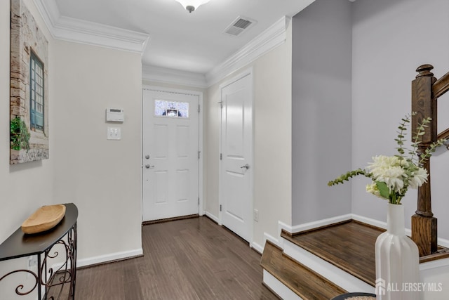 entryway featuring visible vents, baseboards, dark wood finished floors, and crown molding