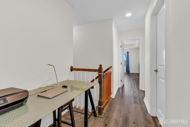 hall with recessed lighting, baseboards, an upstairs landing, and wood finished floors